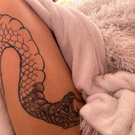 tattoo with the image of a snake