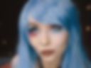 Long blue hair and Harley Quinn-style makeup