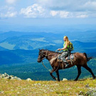 Horse riding in the mountains