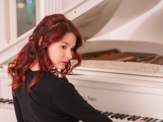 At the piano