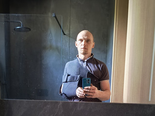 With a broken shoulder