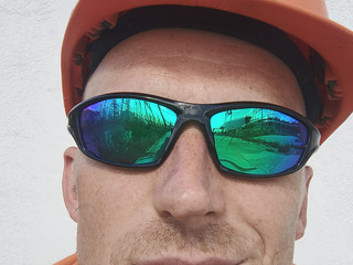 In glasses and helmet.