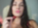 Large breasts in a bra, strawberries in hand