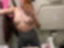Naked on board an airplane.