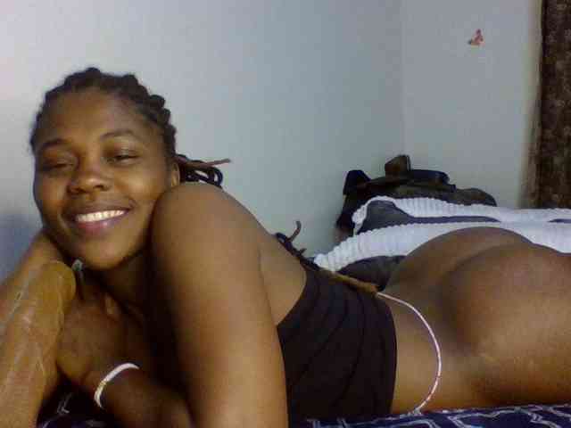 Queenjacky (31, Black Cam Girl) performing deepthroat.
