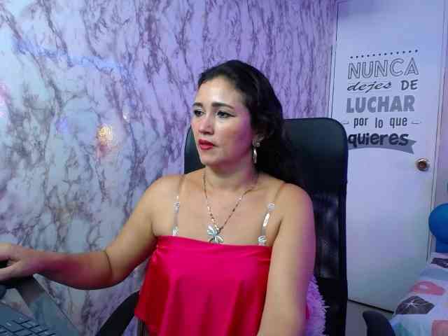 Noelia Milf (42, Hispanic Cam Girl) performing blowjob.